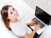 happy-young-beautiful-woman-with-laptop--indoors